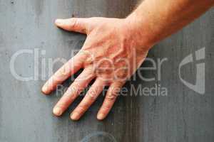 Male Hand Against Grey Background