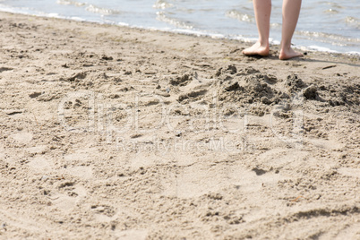 Feet of a woman at a beach