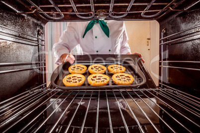 Chef cooking in the oven.