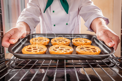 Chef cooking in the oven.