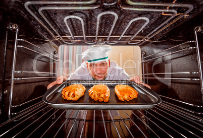 Chef cooking in the oven.