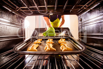 Baking Gingerbread man in the oven