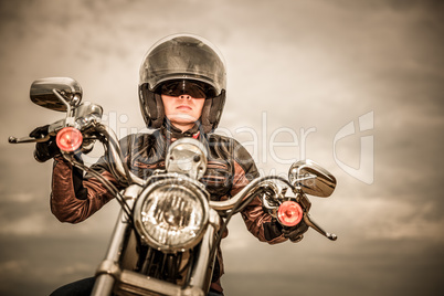 Biker girl on a motorcycle