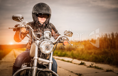 Biker girl on a motorcycle