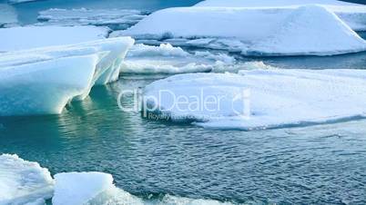 Ice floe breaks down at the glacier lagoon Jokulsarlon in slow motion