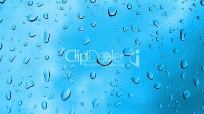Raindrops against blue background