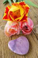 One purple stone heart and three tulips