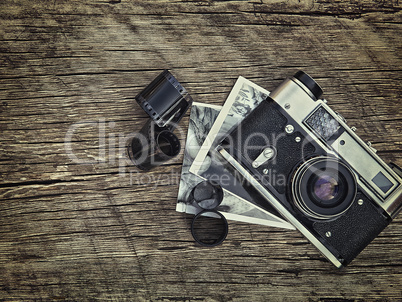 old vintage camera closeup on wooden background