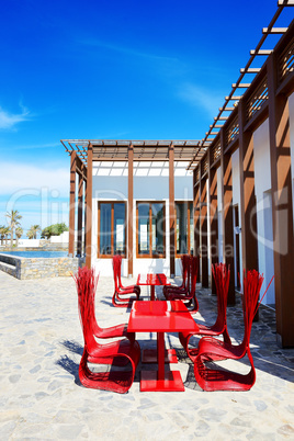 The outdoor restaurant near beach at luxury hotel, Crete, Greece