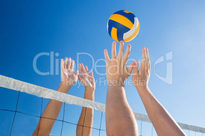 Friends playing volleyball