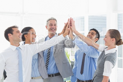 Business people cheering in office