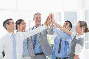 Business people cheering in office