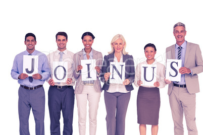 Business people holding letters sign