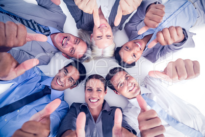 Business people gesturing thumbs up