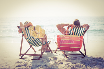 Couple relaxing on the beach