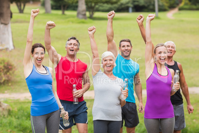 Happy athletic group holding up their fist