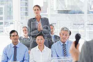 Businesswoman asking question during meeting