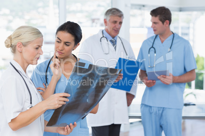 Team of smiling doctors discussing