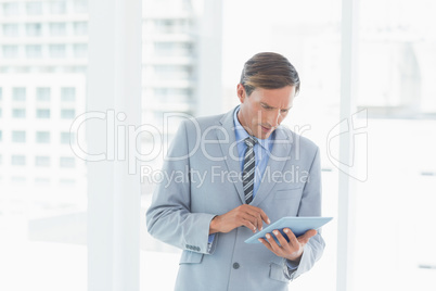 Concentrate businessman using tablet pc