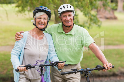 Happy senior couple on their bike