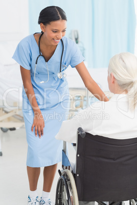 doctors and patient in wheelchair