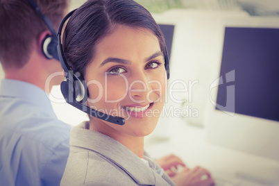 Smiling businesswoman wearing headset