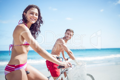 Happy couple going on a bike ride