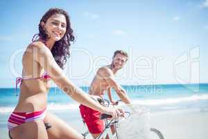 Happy couple going on a bike ride