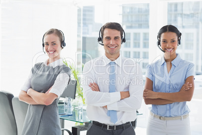 Business people with headsets smiling at camera Business people with headsets smiling at camera