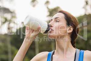 Pretty brunette drinking up water