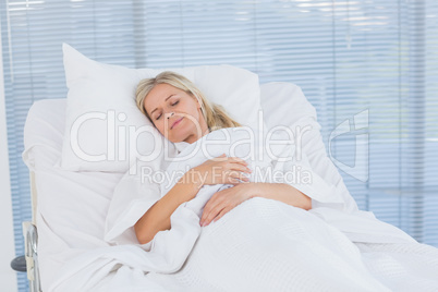 Happy patient lying on her bed