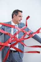 Businessman trapped by red tape