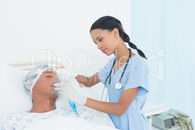 Doctor putting an oxygen mask