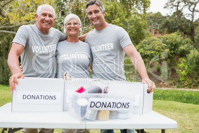 Happy family volunteer smiling at camera Happy family volunteer smiling at camera