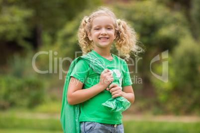 Eco friendly little girl smiling to camera
