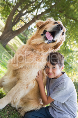 Little boy with his dog in the park