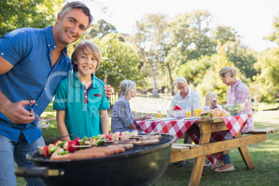 Happy family having picnic in the park