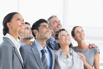 Business people looking up in office