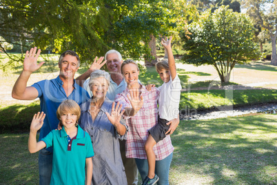 Happy family waving at camera