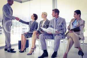 Business people waiting to be called into interview