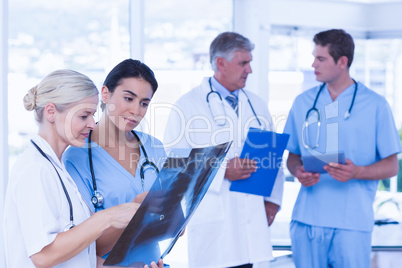 Team of smiling doctors discussing