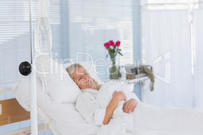 Happy patient lying on her bed