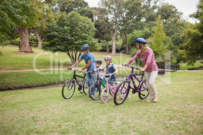 Happy family on their bike at the park