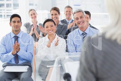 Business people applauding during meeting