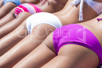 Girls in bikini sunbathing