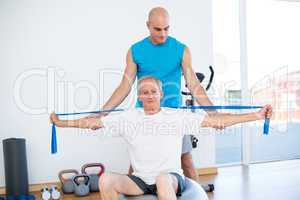 Trainer examining his patient back