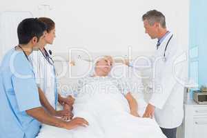 Doctor explaining report to female patient