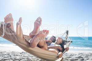 Happy couple napping together in the hammock