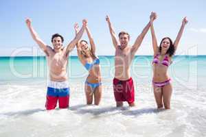 Happy friends having fun in the water together