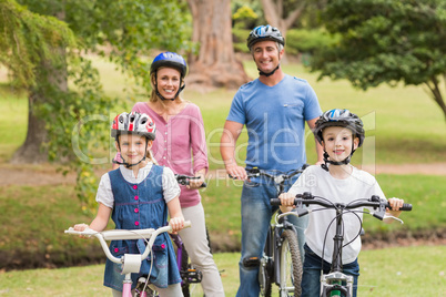 Happy family on their bike at the park